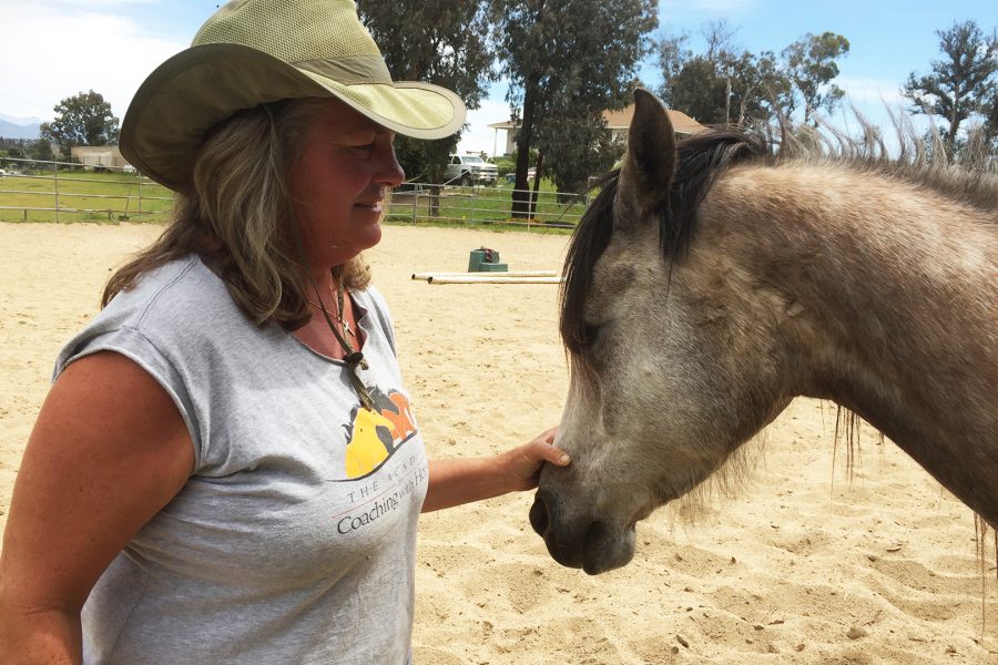 Dee Howe, horse therapist, with one of her horses on her ranch in CA. Photo credit: C. N. Dale/ SAC.Media