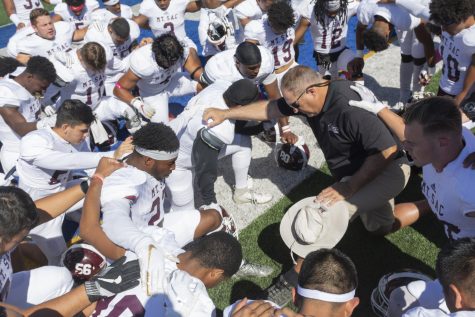 The Mt. SAC football team gathers for a prayer before a game. Photo by Mychal Corbin/SAC.Media.