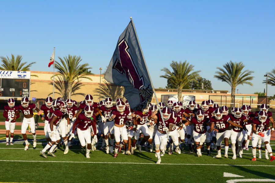 Mt. SAC Football run onto field for a game.