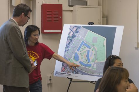 A concerned parent discusses future school plans with architect Marco Eacrett. Photo Credit: Mychal Corbin/SAC.Media.