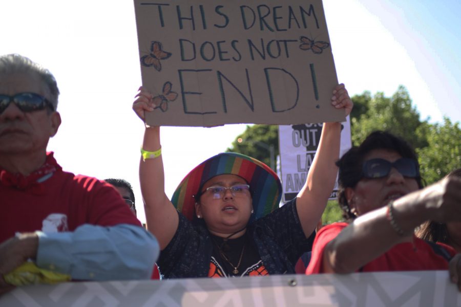 Student Geovanna Costillo held a sign that said, “This Dream Does Not End!” at the head of the May Day March. Photo Credit: Abraham Navarro/SAC.Media.