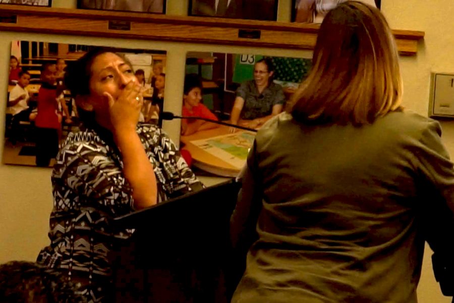 After having Gabriela Navar hand the papers to recall the board, Christine Salazar feels the reality of the HLP Movement during public comment on Sept. 26 at the Hacienda La Puente Unified School District board room. Photo Credit: Joshua Sanchez/SAC.Media.