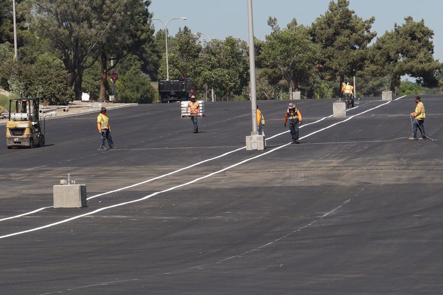 Workers from PaveWest Inc. continue work restriping and redesigning Lot A on Aug. 15. Photo credit: Joshua Sanchez/SAC.Media.