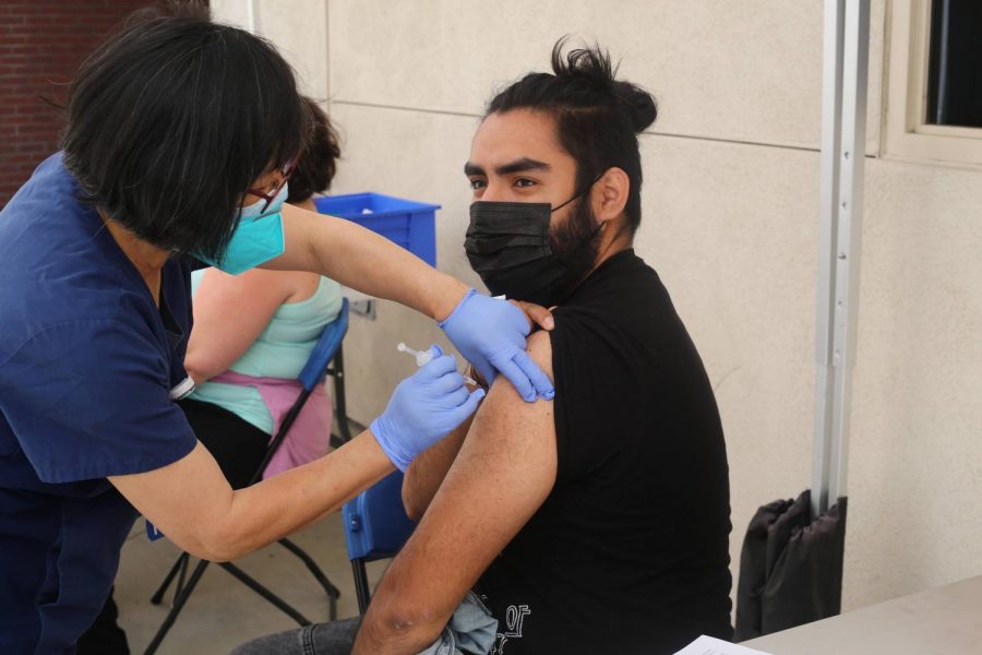 Luis Mendoza receives his vaccine at Mt. SAC on April 8 2021. Photo credit: Abraham Navarro/SAC.Media.