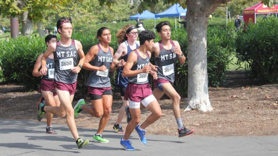 Louis Torres, Kurt Kaihara and Andrew Jagielski join with other Mounties to maintain a steady pace and group morale at the Golden West Invitational on Sept. 24.