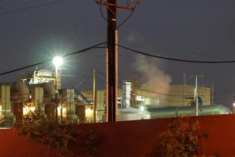 Smoke billows from the west side of the Quemetco facility in the evening hours on Dec. 26, 2018.
