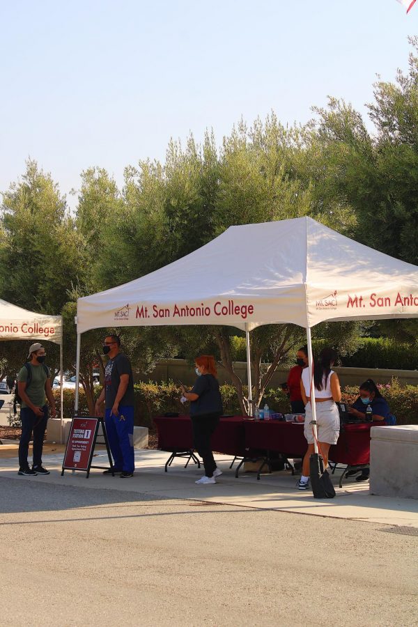 Students administer tests at the testing site near the administration building on Sept. 8.