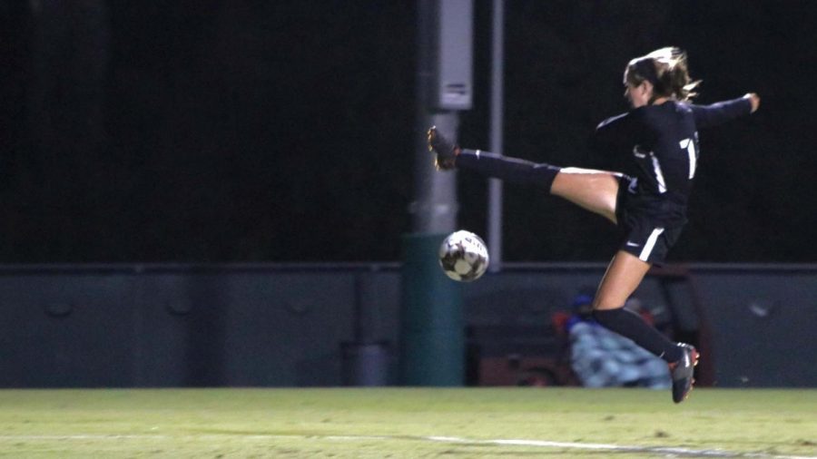 Julia Luceo (14) fields a pass and attempts a midair kick to gain field position.