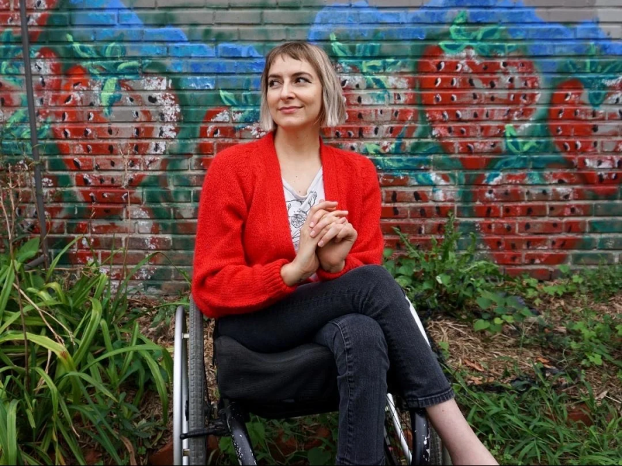Rebekah+Taussig%2C+author+of+a+new+memoir+in+essays%2C+Sitting+Pretty%3A+The+View+From+My+Ordinary+Resilient+Disabled+Body%2C+and+her+experience+growing+up+in+Kansas+after+being+paralyzed+at+the+age+of+three+from+cancer+treatments+is+a+true+inspiration+to+Hines.%0A%0A%28Photo+courtesy+of+Rebekah+Taussig%29