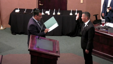 Former council member Jorge Marquez administers the oath of office to Hector Delgado. Photo courtesy of City of Covina.