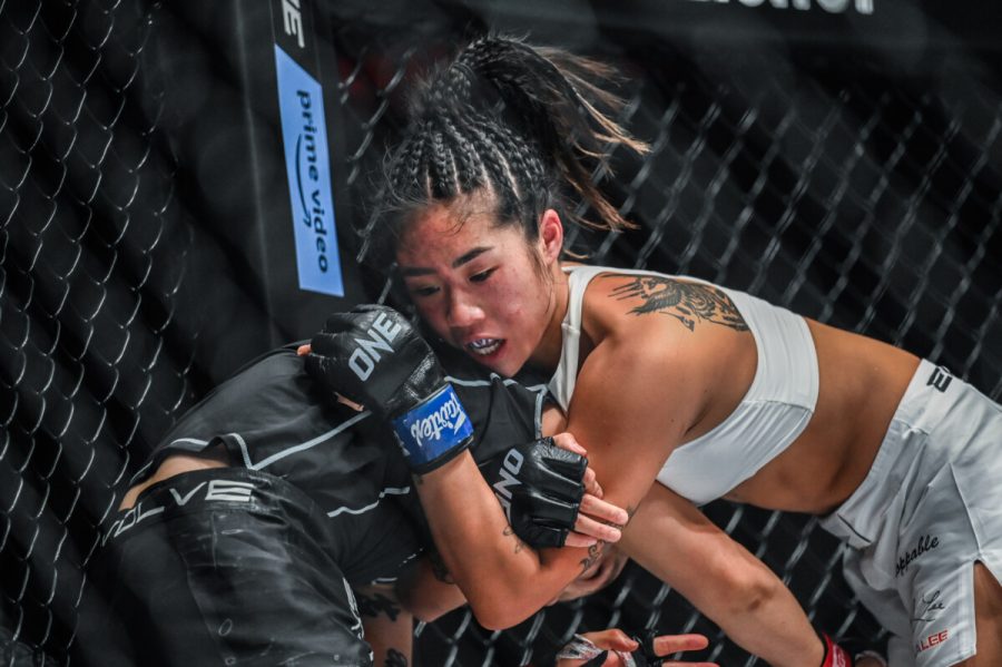 Angela Lee (right) and Xiong Jing Nan (left) battle for position against the cage during One on Prime Video 2 on Sept. 30 (via ONE Championship).