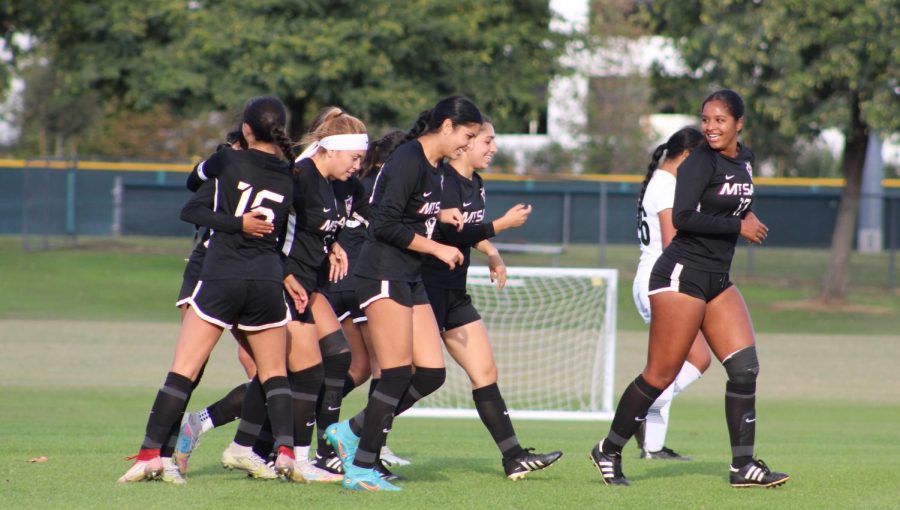 The women’s soccer celebrated after sophomore midfielder Kaylee Gutierrez (8), scored a goal in the 59th minute during the South Coast Conference Tournament semifinals.
