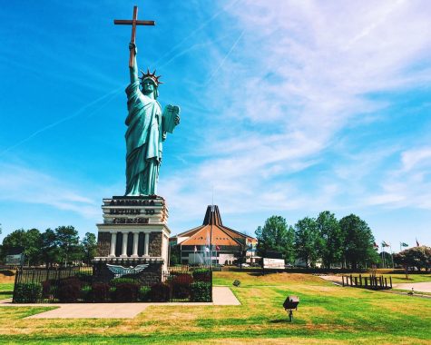 A replica Statue of Liberty holding the Christian cross outside of the World Overcomers Outreach Ministries Church in Memphis, Tennessee. Photo courtesy Kathy Drasky/Flickr