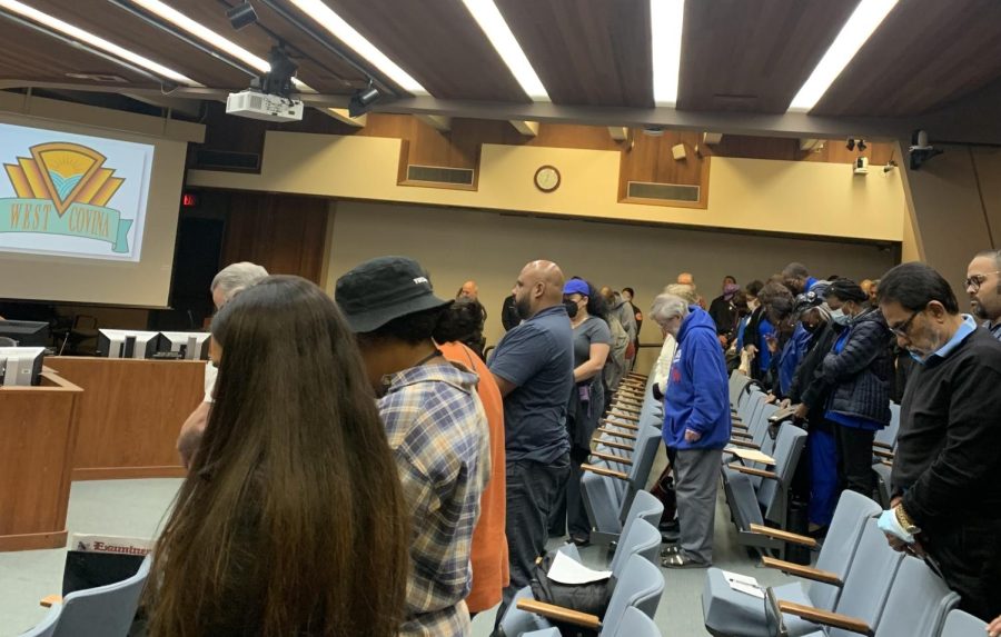 West Covina residents, including members of the NAACP (right) bow their heads in prayer at the Feb. 7 City Council meeting.