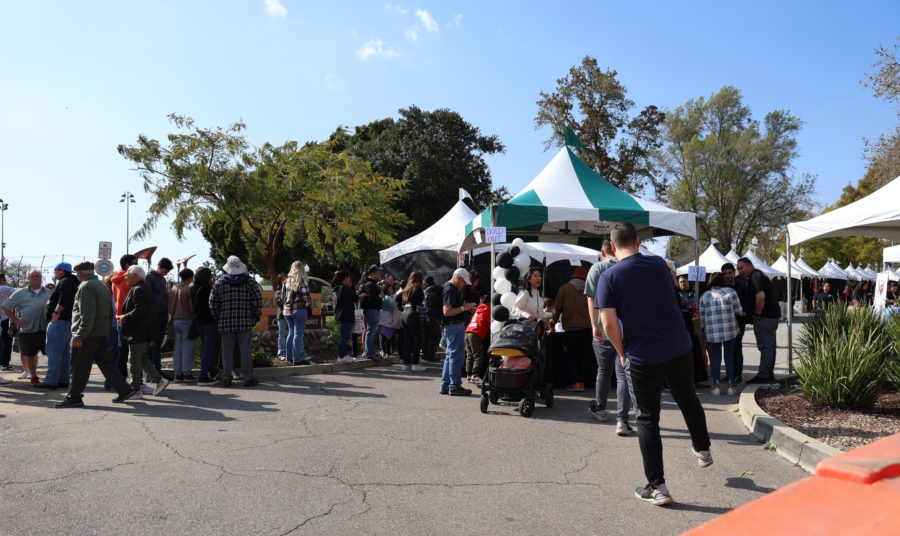 A crowd lines up to enter the Taste of Walnut event before it starts in Suzanne Park, Walnut, California, on March 25.