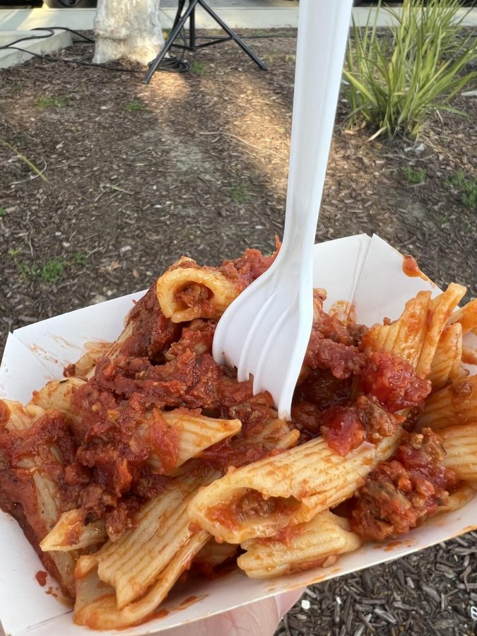 Mr. Gs pizza is serving penne pasta with meat sauce.