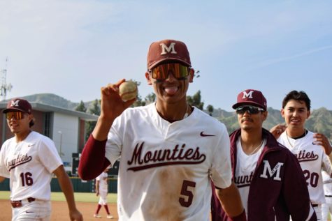 Sophomore left-handed shortstop Elijah Pelayo (5) with a game ball in between innings of the opener against the Warriors.