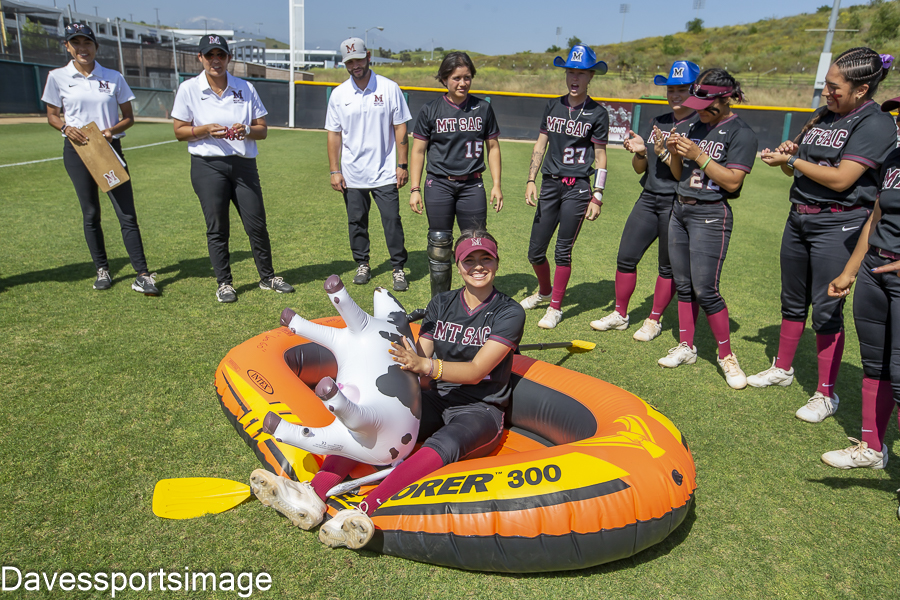 Sophomore third baseman Olivia Ortiz (14) leading her team in a postgame celebration after sweeping Bakersfield College. Via davesportsimage.