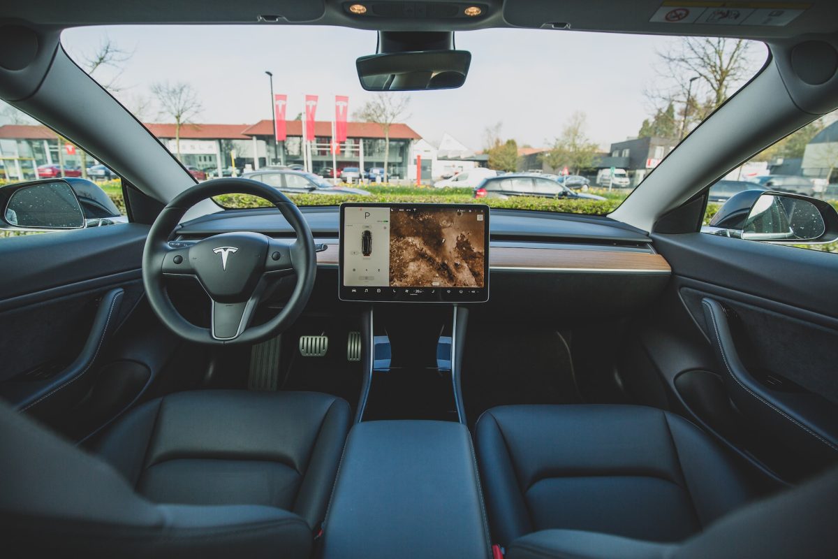 Tesla Model 3 complete with functionality hidden behind a sleek touchscreen interface, a headache-inducing acceleration pedal and a hidden gearshift.