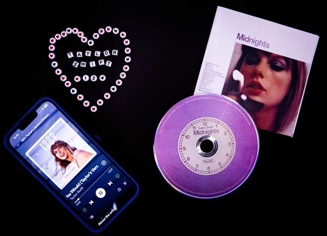 Taylor Swift items spread out on a table.