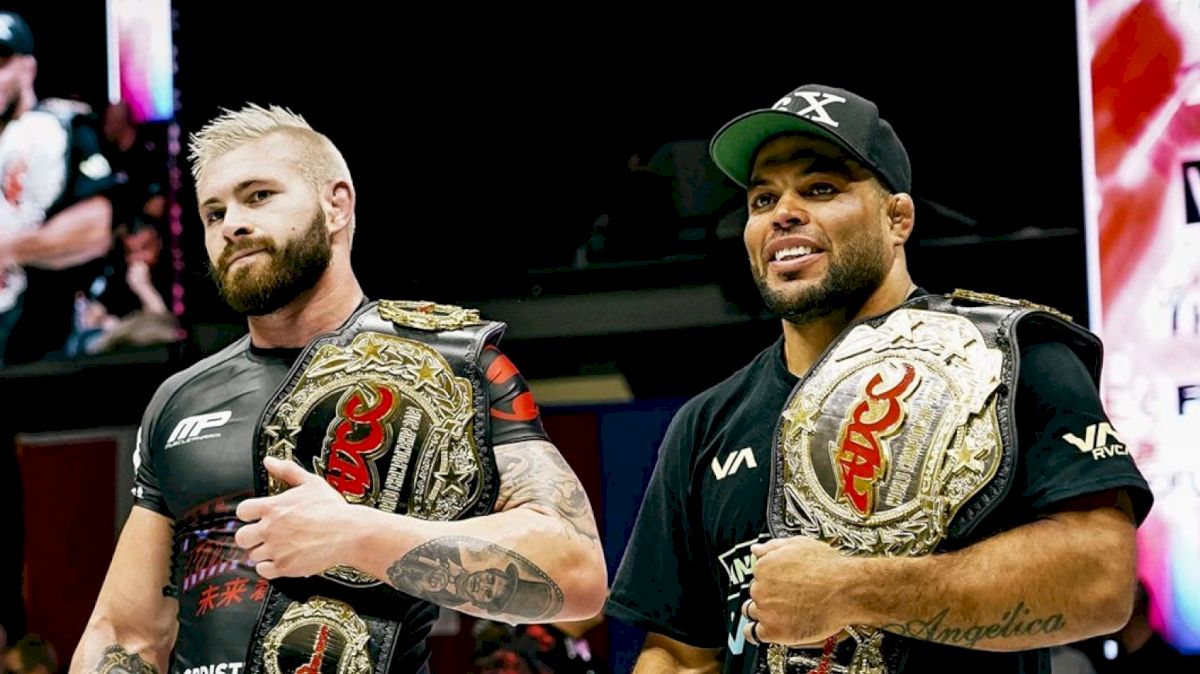 Gordon Ryan and Andre Galvao receiving their belts after their respective matches.