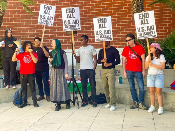 Students for Socialism holding signs stating, End all U.S. Aid to Israel at the building 26A courtyard.