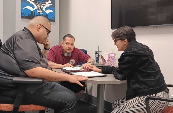 Rising Scholar Director Joe Louis Hernandez Ph.D. (Left), Peer Mentor and Rising Scholar student , Timoteo Benitez and Precious Angel Padilla (Middle), Project and Program Specialist (Right) review upcoming plans.