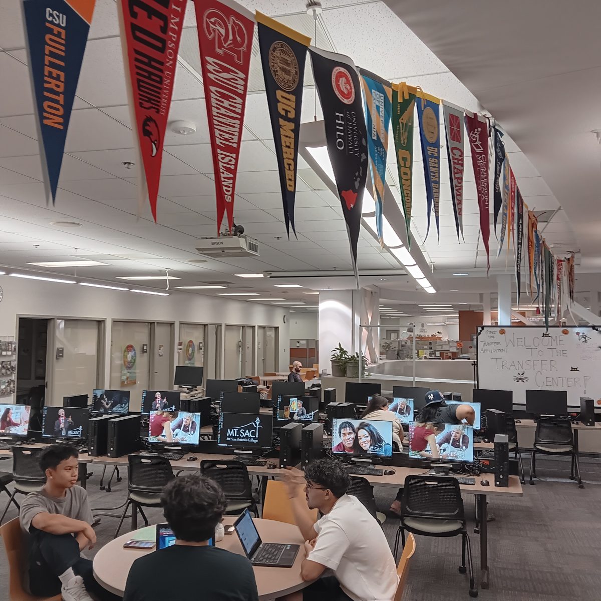 From left to right: 17-year-old kinesiology major Jermy Jao, 18-year-old Kinesiology major Justin Olinger, and 18 -year-old Business Mangement major Anirudh Paliwal discuss prospective schools. 