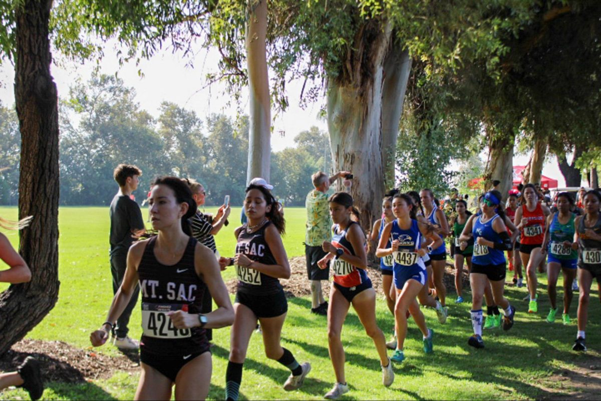 Sophomores Kahlai Cruser and Denise Villarreal leading SAC at the start of the women's race