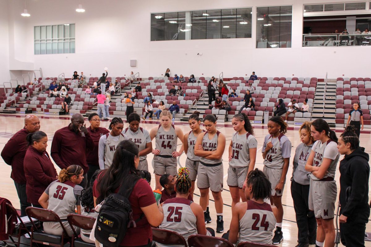 Head coach Brian Crichlow talking to the team during time out