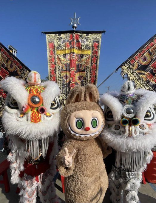 Labubu mascot posing at a festival