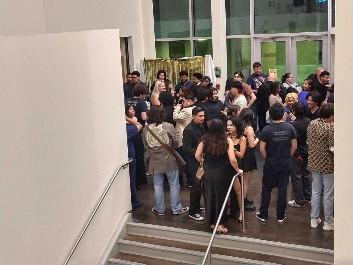 Film makers and members of the audience gather outside the auditorium in building 13 after a viewing od student films. 