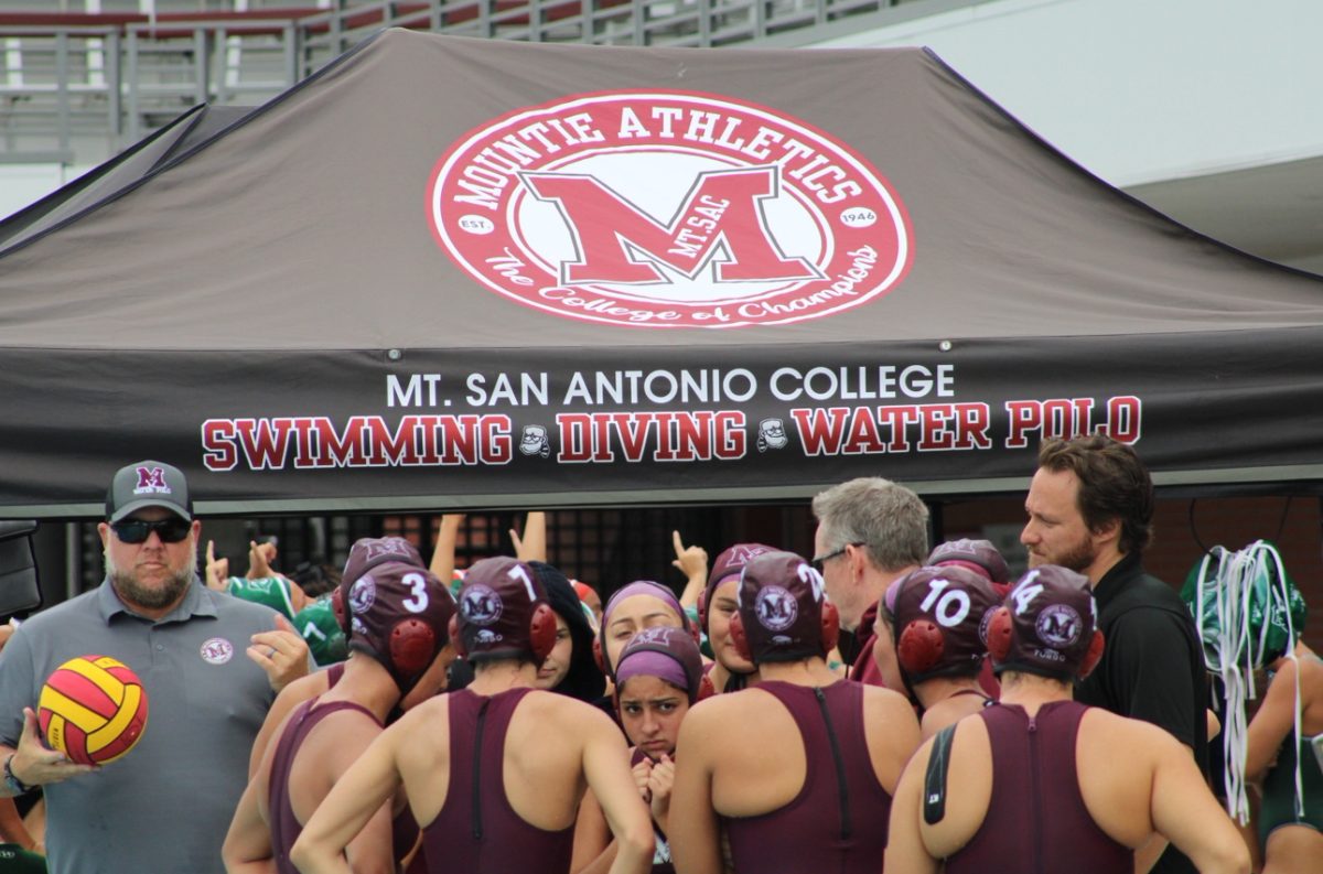 SAC talking over their game plan before heading into the pool.
