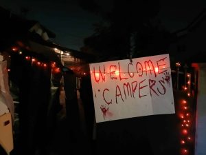 Entrance to the party with a sign that reads 'Welcome Campers'.
