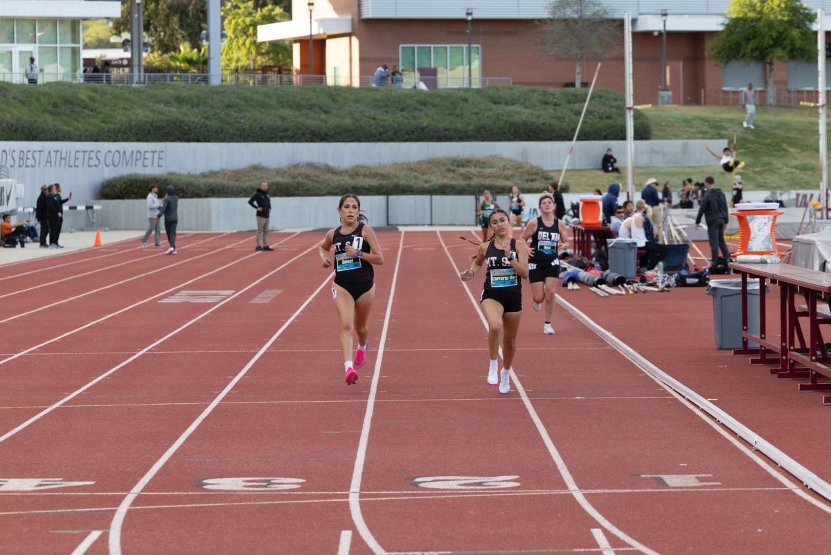 Sophomore Sophia Ebiner and freshman Jocelyn Izarraraz - Rodriguez staying close together through the entire race. 