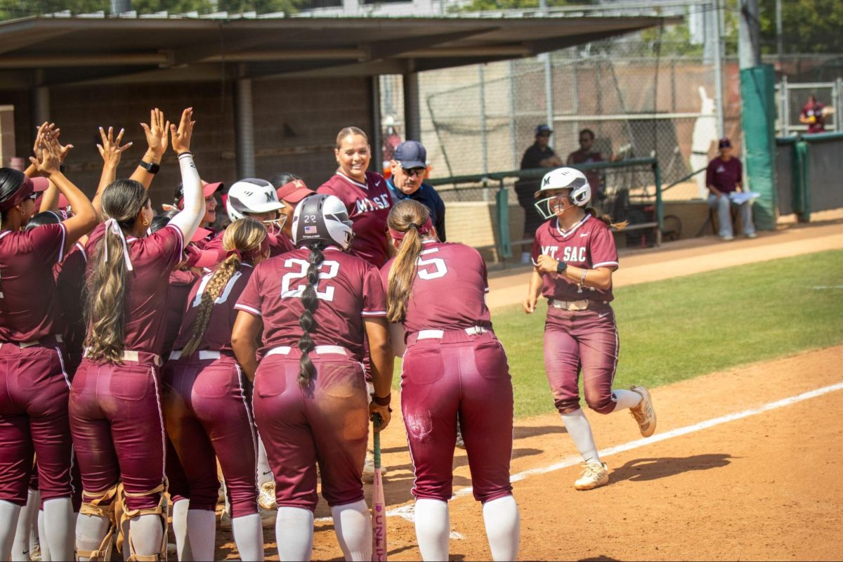 Sarai Raygoza (14) runs to home plate after her fifth inning homer. 