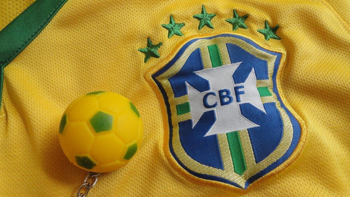 Closeup shot of Brazil’s home jersey, featuring five stars which represent the nation’s five FIFA World Cup victories. Brazil’s the most successful nation in the history of the tournament. Image by artselisonmorais0 from Pixabay